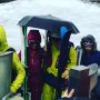 When you are skiing and there's so much rain you bring an umbrella.