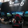 【東京オートサロン2016】中央ホール4前の通路にはGRAN TURISMO6のブースが設置されています トリプルモニター+ドライビングシート筐体のレースゲームは迫力あるなー