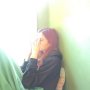Girl in a window in green