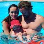 7 months old Mia and her parents in the pool in France