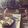 when the cat is away the mice eat hotdogs on the table on the deck
