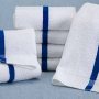 A soft blue and white pool towel by Martex for your home or business!